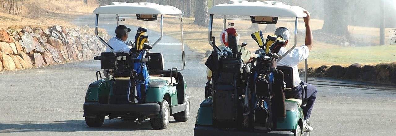 Cardinal and Rabbi in Golf Carts